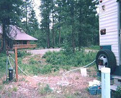 Photograph of mobile water quality laboratory taking samples of water from a domestic well in the Methow Valley (Photograph taken by Rick Wagner, U.S. Geological Survey, July 2001.)